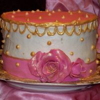 F_1176870069.jpg Practicing for my daughters wedding. 6" butter pecan with BC frosting and fondant trimmings , piped with gel and painted with gold...
