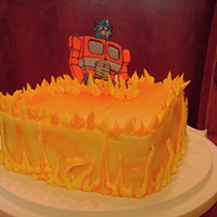 Transformer Cake Iced in buttercream. First day using airbrush. Color flow transformer. Buttercream flames.