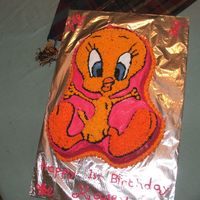 Tweety Tweety using Wilton cake pan decorated in buttercream on a chocolate mud cake