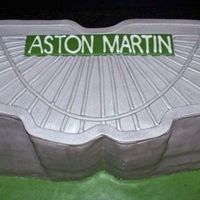 Aston Martin Cake Modelled after the Aston Martin logo.