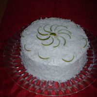 Lemon Coconut Cake Lemon cake with coconut filling. Decorated with Limes peels. So yummy!