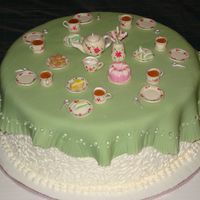 Tea Party Cake This was made for a girl's 8th birthday with the theme of a tea party. Everything is edible except for the flowers in the vase. The...