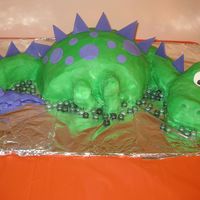 Dinosaur Cake Dinosaur cake for my son's 3rd birthday. He loves purple, so I did a green dinosaur with purple accents - thank you to all on CC for...