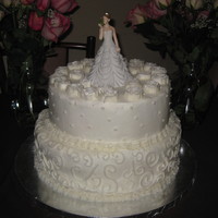 Princess Kissing Frog 2 tiered butter cake with BC icing. Cake topper bought online. Flowers BC also.