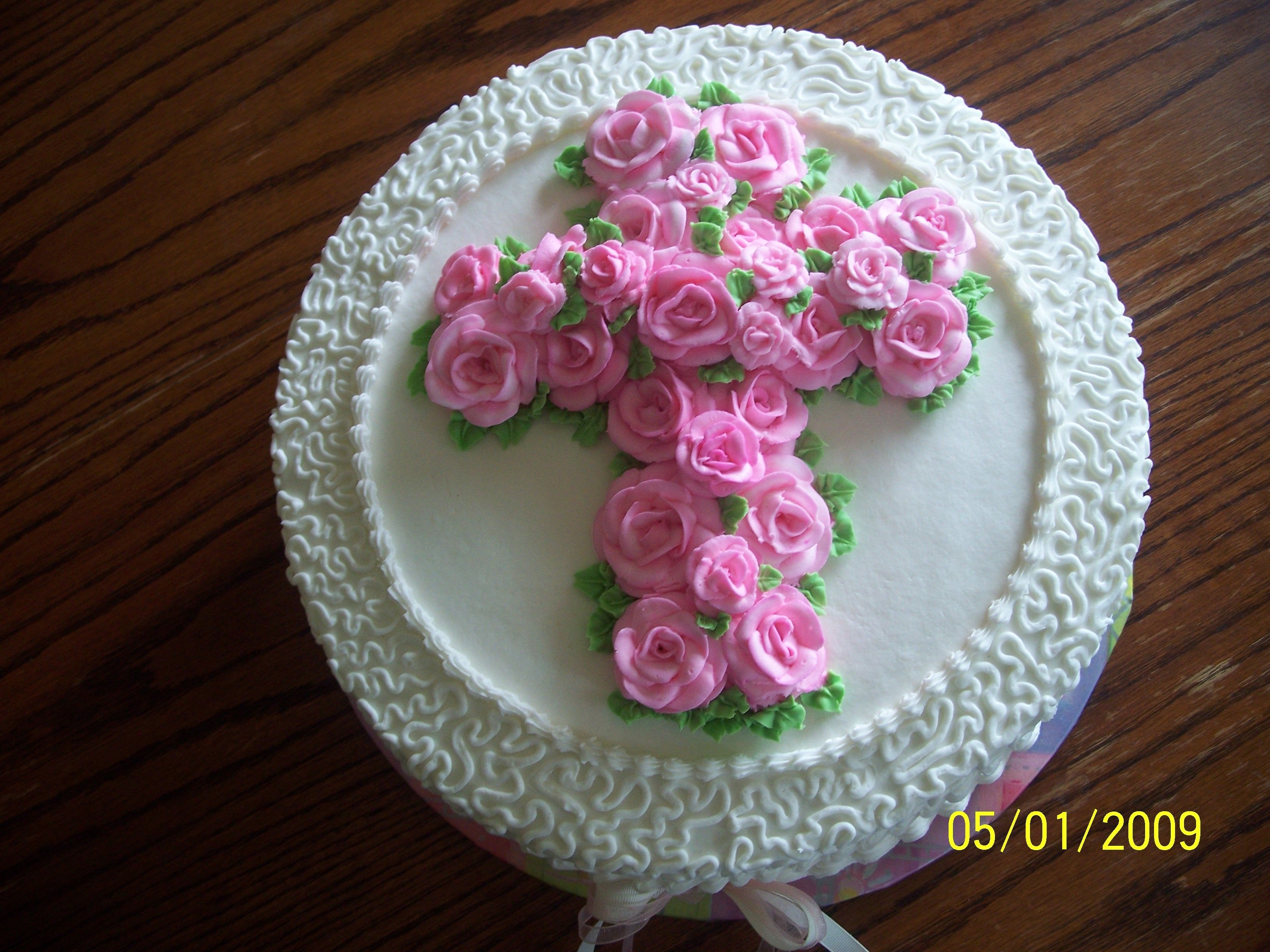 Communion W/ Pink Roses 12" White cake w/ raspberry filling, buttercream roses, cornelli lace and ribbons. I LOVED this cake!