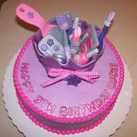 Make Up Cake For Spa Party Buttercream icing on cake with all fondant makeup and make up bag.
