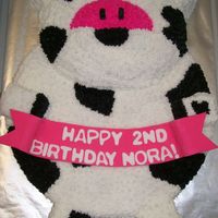 Jersey Cow Cow cake with wilton's animal cracker pan stacked on a round.