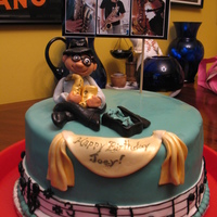 Musician's Birthday all fondant except for the pic provided by kid's mom that was stuck on skewers into cake. the music border is actually the tune to...