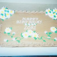 Chocolate With Daisies Chocolate with Chocolate Buttercream and Royal Icing Daisies.