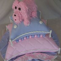 Puppy Pillows Chocolate and White cakes covered and decorated with fondant. Puppy is made from cupcakes covered in buttercream.