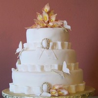 Butterfly Wedding Cake VANILLA CAKE WITH ALMOND FONDAT WITH CALLA LILYS AND BUTTERFLIES.