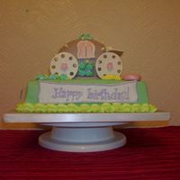 Princess Carriage Made for my 3 year-old's birthday party. Vanilla "carriage" with gumpaste wheels. The base is chocolate filled with ganache...