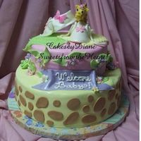 Baby Giraffe i made this cake for a friend who is having her first baby. bottom layer is dark chocolate w/ almond butter cream. top layer is butter cake...