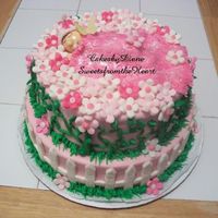 Pink Flower Baby fondant covered lemon and chocolate cake.everything is made with fondant. baby blanket is dusted with pearl dust. butterfly is rice paper....