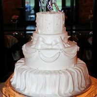 Vanessa My favorite cake I have made....16, 12, 8,6 All covered with white chocolate fondant. My first fondant skirt and swags. Cake was airbrushed...