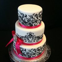 Debbie All fondant, blackstencils....satin ribbon and broach.