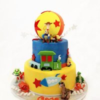 Gage Cakes are 9 and 6 All buttercream, airbrushed. 4 inch styrofoam ball covered in fondant....cake has toys and fondant accents.