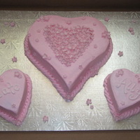 Birthday Hearts Fondant flowers over buttercream for 2 little girls birthdays; one heart for each sister and a big one for the family!