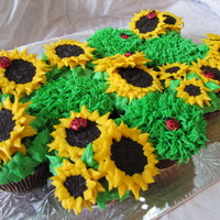 Sunflower Cupcakes Sandwich cookie sunflowers and candy coated chocolate ladybugs.