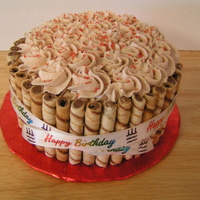 Cake With Cookie Border This cake is accented with rolled cookies (sorry I don't know the name) and a Happy Birthday Ribbon.