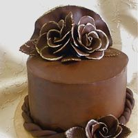Chocolate Chocolate cake with whipped ganache filling and poured ganache on the outside. It was my first time covering a cake in ganache. The roses...