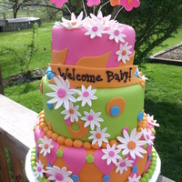 Baby Shower Cake Three tiered cake done in fondant. Girl asked for something bright and colorful. She brought me a few pictures of what she liked...she...