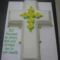 Cross Cake Cross was cut from a 12x18 sheet cake and edges beveled. Simple flowers to accent. Cake was for a memorial service.