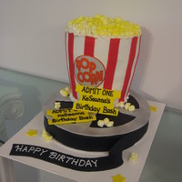 Popcorn And Movie Reel This cake was a 12" round as the movie reel base. Silver "metal" part of reel was cut from fondant and sprayed with silver...