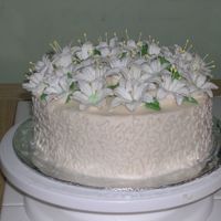 Our First Easter Cake My daughter and I have been taking the Wilton courses. We had just learned how to do the lily, when Easter arrived. Our first time with the...