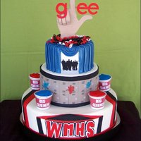 Glee Cake Covered in fondant with cupcakes in the slushie cups. The glee logo and hand were gumpaste and the logo, WMHS letters, and silhouette was...