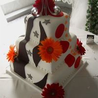 Mixed Up This couple wanted 2 different cake designs so each of them designed 1/2 (2 panels) of their wedding cake. My wife decorated the Bride 1/2...