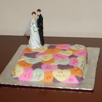 Our First Anniversary Cake I made this for my husband and me. The couple is from our wedding cake (see picture in cake central.)I had a lot of fun cutting out the...