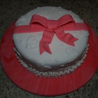 Valentine's Day Cake The cake and cake board are covered in fondant. The cake is covered in fondant overlays & fondant bow.