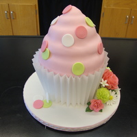 Gigantic Cupcake With Sugar Flowers I made this gigantic cupcake on behalf of my daughter's Odyssey of the Mind team for the creative cake contest. I made gumpaste roses...