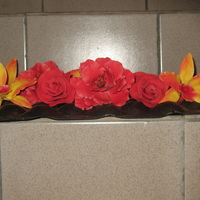 Shades Of Red Flowers to be used on a dummy cake. A mix of orchids and roses