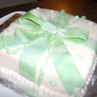 Wilton Course 3 Package cake with a pretty swirl bow