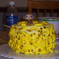 Ashley's Monkies my attempt at a monkey with bananas cake. the bananas kept falling off of the sides of the cake.