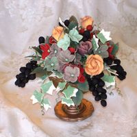 Fall Flowers Sugarpaste flowers in a sugarpaste vase. This is going to be the topper for a Tuscan, fall-themed display cake for the Mid-State Fair next...