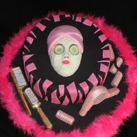 Dsc01442.jpg Chocolate cake with chocolate ganache with Grand Marnier filling. All decorations are either gumpaste or chocolate that has been painted....