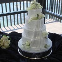 Traditional Wedding Cake Top and bottom tiers are white chocolate cake with hazelnut BC filling, the two middle tiers are red velvet cake white chocolate cream...