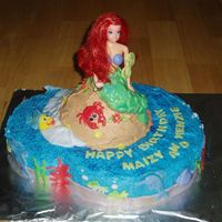 Mermaid Cake vanilla cake with buttercream and fondant decorations. it was (2) 12" rounds, 1 wilton doll cake pan with doll pick, i swapped out the...