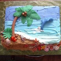 Casey's 5Th Cake We had just gotten back from the carribiean and DS says,"Mom, I want an ocean cake with a dolphin jumping, seashells, a palm tree and...