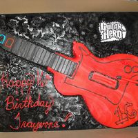 Guitar Hero My nephew's 16th bday party cake. I cwas very happy to do this. It was my first time making and using fondant. I cut it from a half...