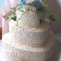 3 Tier Hearts 3 Tier wedding heart cake. Flowers and ivy made out of gumpaste.