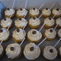 Cupp'a Joe Cupcakes My Cappuccino cupcakes with Vanilla buttercream speckled with coffee. Topped with a chocolate covered coffee bean and a coffee stirrer.