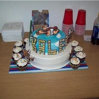 Captain Underpants Cake for my nephew. 12 inch white w/ lemon, and 9 inch Banana w/ Vanilla. Chocolate cupcakes with Mock Whipped Cream frosting. Frosting on...