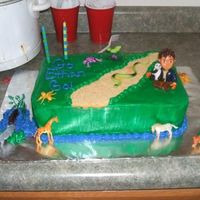 Go Ethan Go! My son's 2nd birthday cake. 2 layer white and chocolate with BC. Diego and animals are toys.