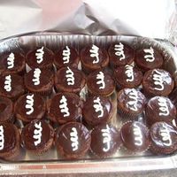 Home Made "hostess Cupcakes" Devils food cupcakes with buttercream filling. Dipped in Ganache with a buttercream swirl.
