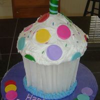 Jumbo Cupcake this was so fun to do! we used parchment paper to make the cupcake liner. the cake is frosted with buttercream frosting, and the sprinkles/...