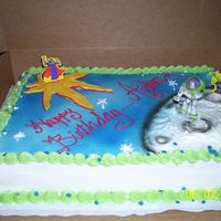 Buzz Lightyear Made with Cake Kit, airbrushed the top and used sprinkles.